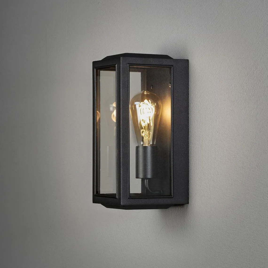 Carpi vegglampe utendørs IP44 - Svart/Klart glass